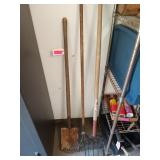 Three yard tools with wooden handles