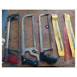 Three hacksaws with extra blades