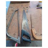 Three hand saws, one is a bow saw