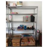 Six-tier metal shelving unit on wheels,