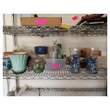 Shelf contents, mostly flower pots and gardening