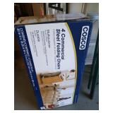 Four commercial steel folding chairs from