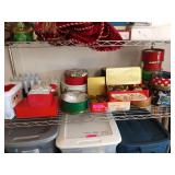 Shelf of Christmas decorations, including tins