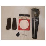 Pair of 1911 grips, gun cleaning rod, patches