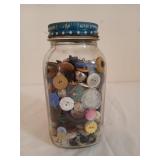 Quart jar of assorted buttons