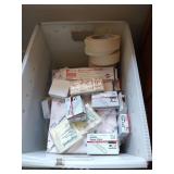 Postal tote full of office supplies including