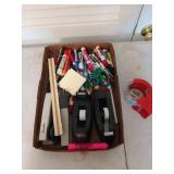 Office supplies, including rulers, staplers,