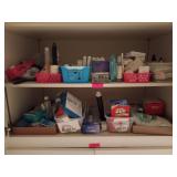 Two shelves of bathroom supplies, including