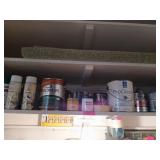 Shelf of paints, wood finishes, etc