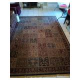 11 x 7.5 floral area rug, has damage spot