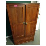 Wooden media cabinet with lion head drawer