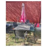 Middle outdoor patio table four chairs, and