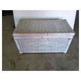 White wicker chest with contents mostly teddy