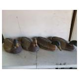 Four plastic Flambeau duck decoys by ducks