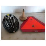 Adult bicycle helmet, tractor caution sign, and
