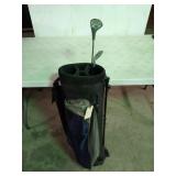 Blue golf bag with two clubs, a Dunlop 3 wood a