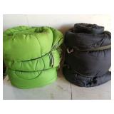 Two sleeping bags, one green one black