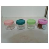 Set of four glass 7 fluid oz jars with plastic