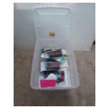 Clear storage bin filled with painting /