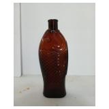 10 inch Amber glass bottle in the shape of a