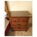 Nightstand with glass top and three drawers,