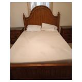 Queen size bed with mattress and blankets