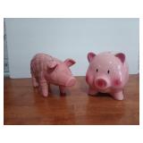 Two Pink Piggy banks, one looks like a blingy sofa