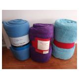 Two microplush throws, and a fleece throw, 50x60