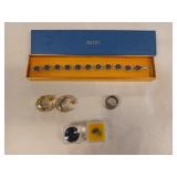 Assorted jewelry, and gems? Includes an Avon