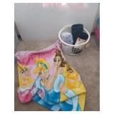 Plastic basket filled with blankets, one is