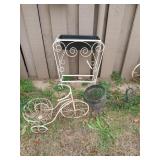 Three plant stands, two are shaped like