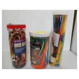 Two canisters of colorful cable ties, and a tube