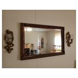 Beveled mirror with ornate frame, 24x36 in, and