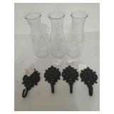 Three 8 inch glass bottles, and four 5-in towel