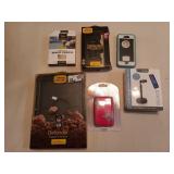 Assorted phone protectors, wallets, iPad Pro