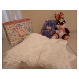 Two cute bunnies and a white throw blanket in a
