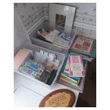 Contents of corner, includes books, two tubs