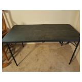 Black folding plastic table with adjustable