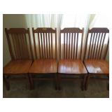Four heavy duty wooden kitchen chairs