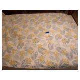 Green and blue Leaf patterned quilt, has some