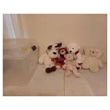 Five fluffy stuffed animals, mostly winter