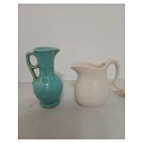 Two pitchers, both marked USA, the blue one is 7