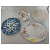 Assorted plates and serving dishes, the largest