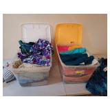 Two clear plastic tubs filled with women