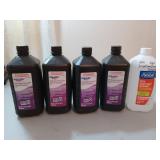Four unopened bottles of hydrogen peroxide, one of