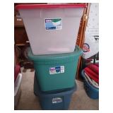 Three empty storage totes, green, blue, and