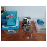 Three storage tubs, one is empty, one is full of