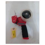 Red Scotch tape gun with nearly full roll of