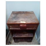 Old wooden nightstand with drawer and two