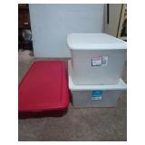 Three storage tubs, one is red for under the bed